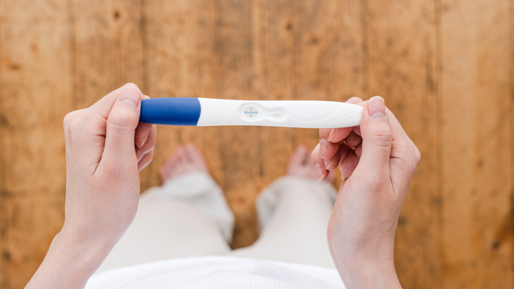 lady holding pregnancy test